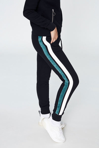 Shop aada joggers black with side stripes by Armedangels on thegreenlabels.com