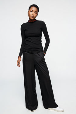 Shop naimaa pants black by Armedangels on thegreenlabels