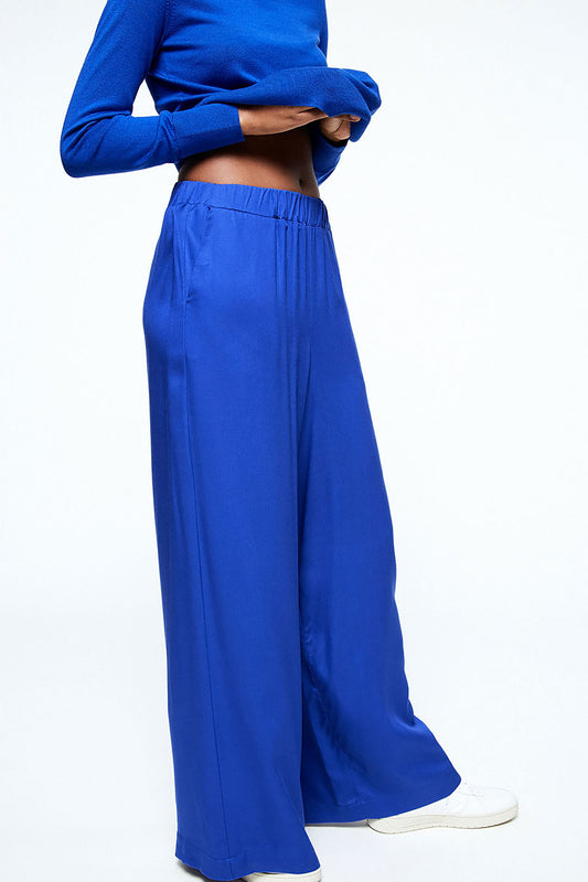 Shop naimaa pants signal blue by Armedangels on thegreenlabels