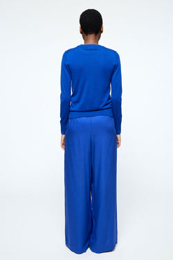 Shop naimaa pants signal blue by Armedangels on thegreenlabels
