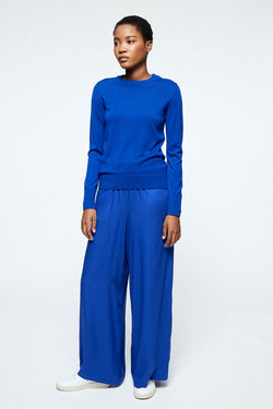 Shop naimaa pants signal blue by Armedangels on thegreenlabels