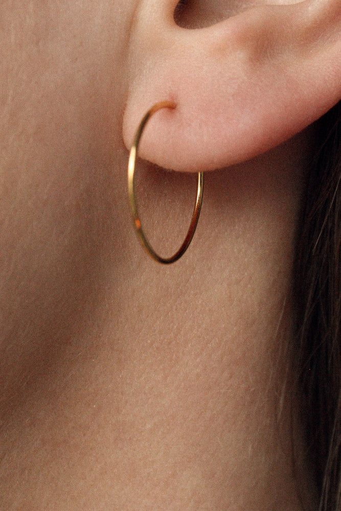 infinity earring hoop gold by Neinties on thegreenlabels