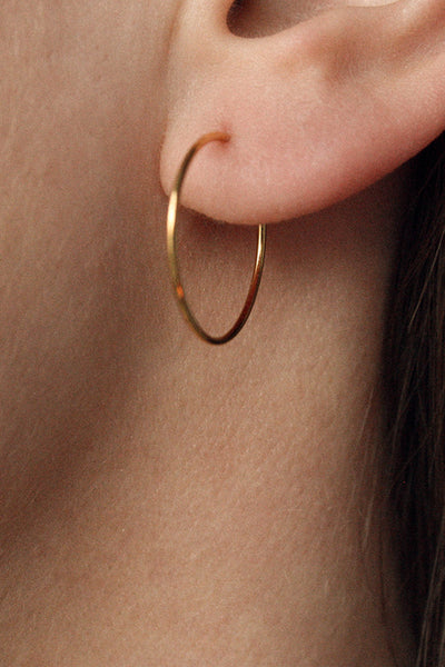 infinity earring hoop gold by Neinties on thegreenlabels