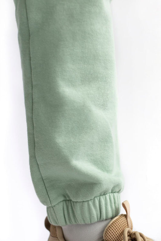 shop matcha green loose pants by capsule studio at thegreenlabels