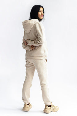 shop almond latte loose pants by capsule studio at thegreenlabels