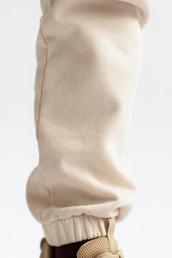 shop almond latte loose pants by capsule studio at thegreenlabels