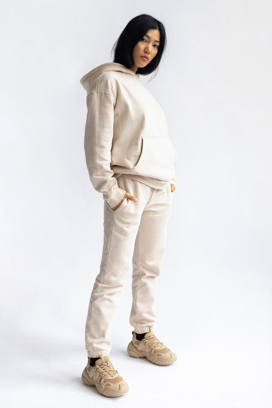 shop almond latte loose pants by capsule studio at thegreenlabels